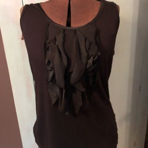 Sleeveless black top with ruffle
